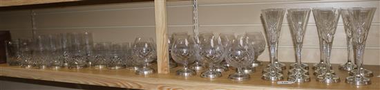 A set of twelve champagne flutes, Brandy balloons, spirit glasses and water glasses and two wine coolers,